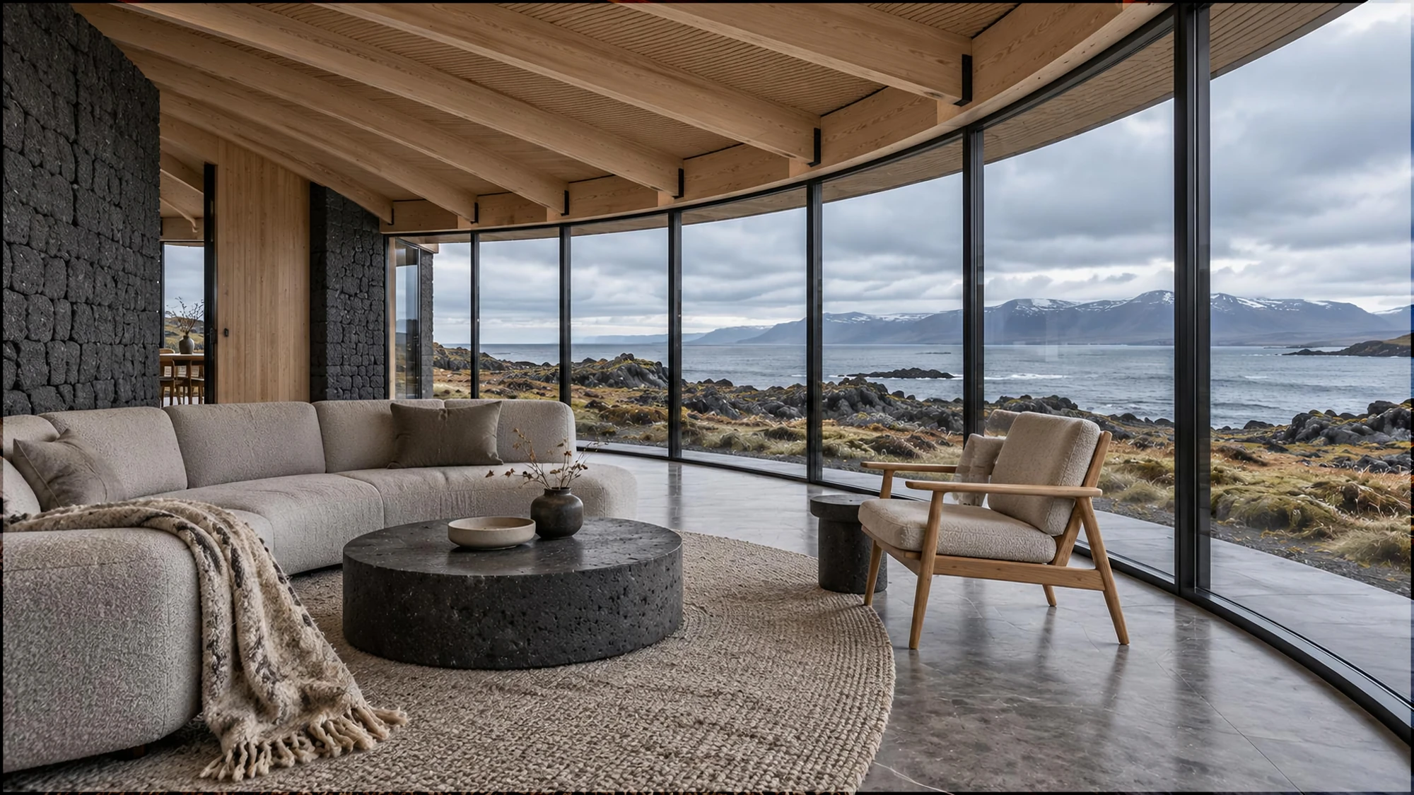 Intimate contemporary living space beneath exposed curved timber roof ribs, with tactile wool furniture, dark stone and views across the Icelandic landscape